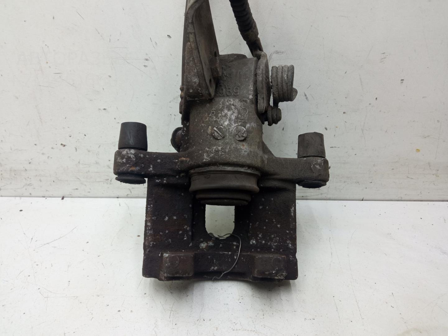 Суппорт задний левый