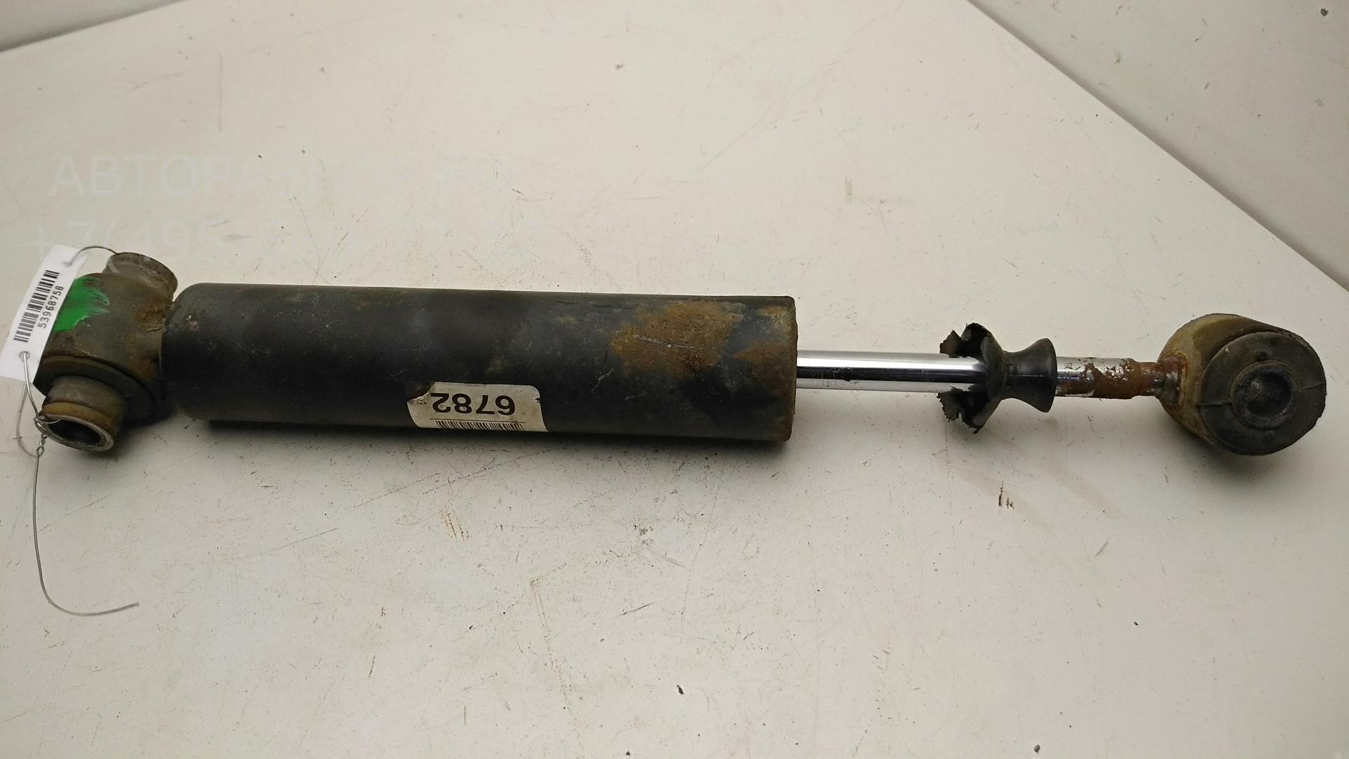 Амортизатор задний левый