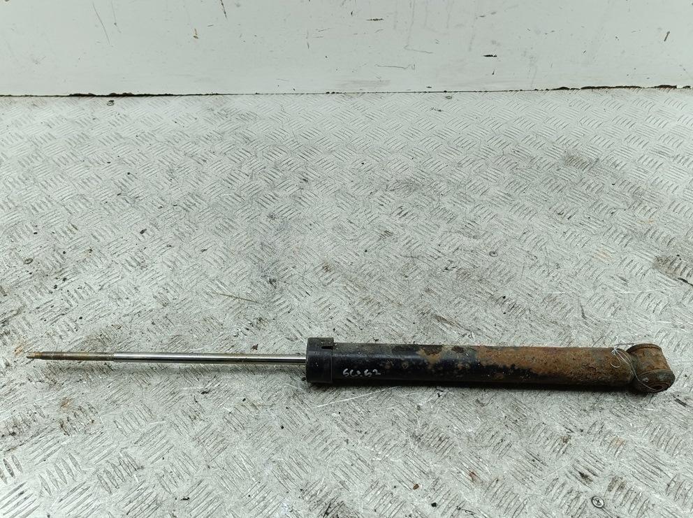 Амортизатор задний левый