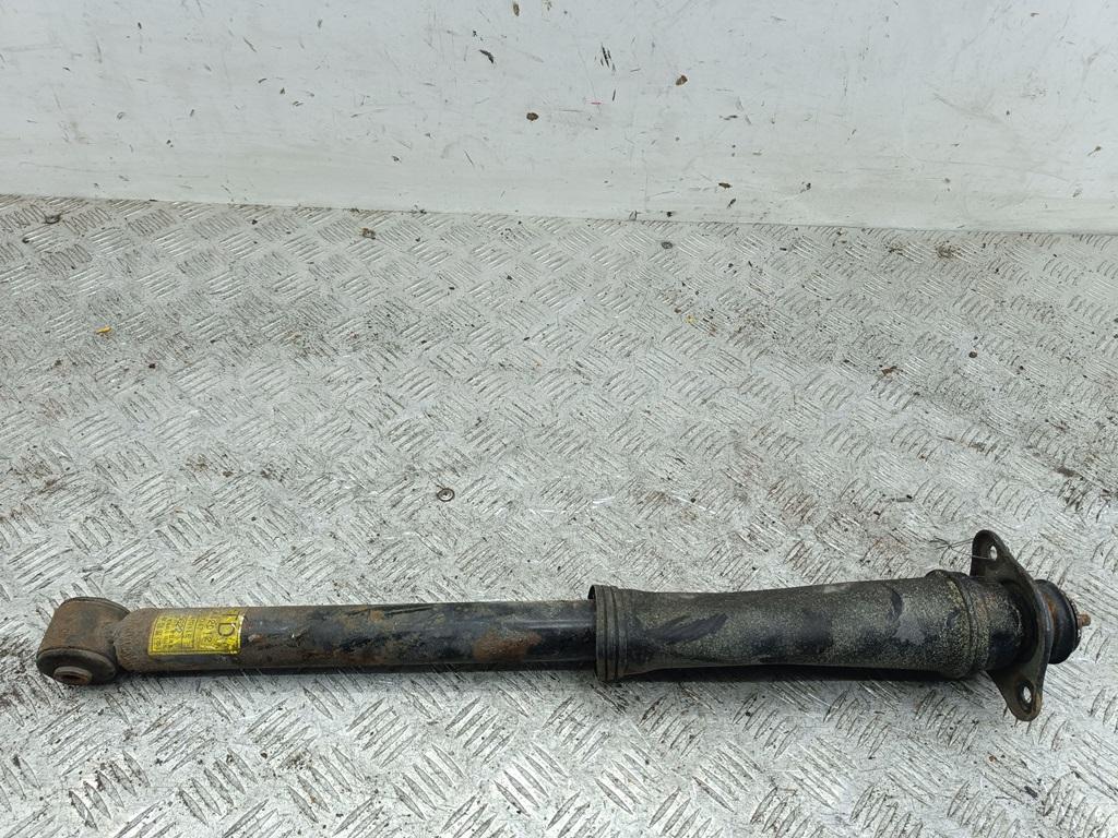 Амортизатор задний левый