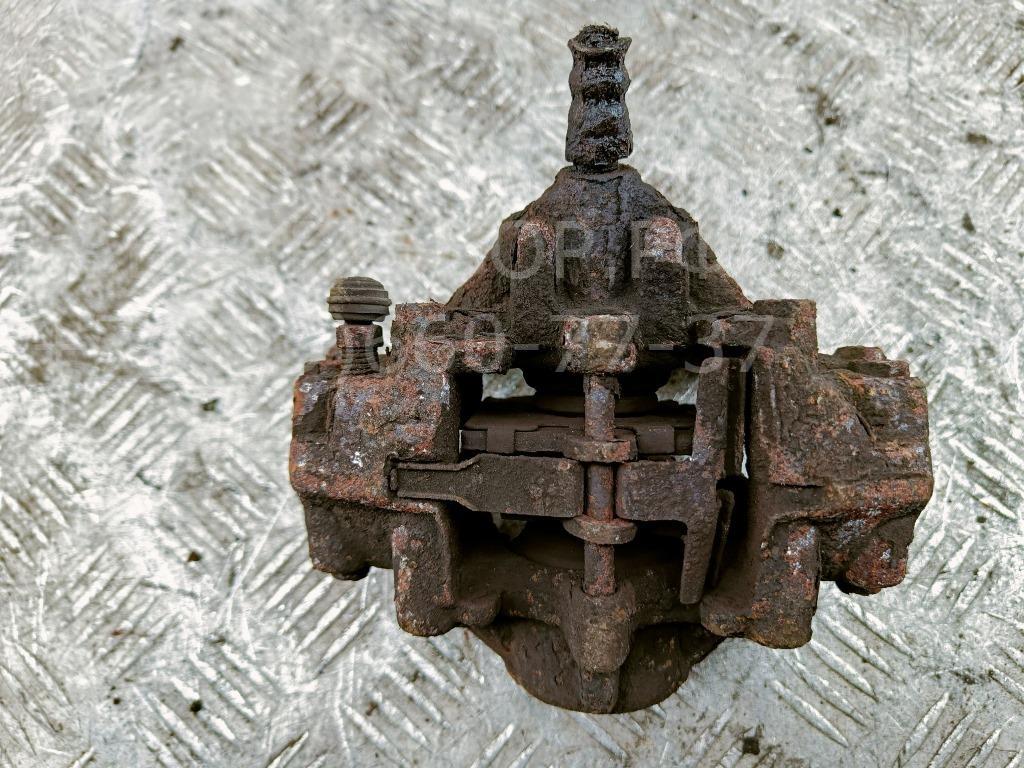 Суппорт задний левый