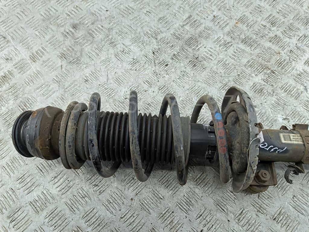 Амортизатор передний левый