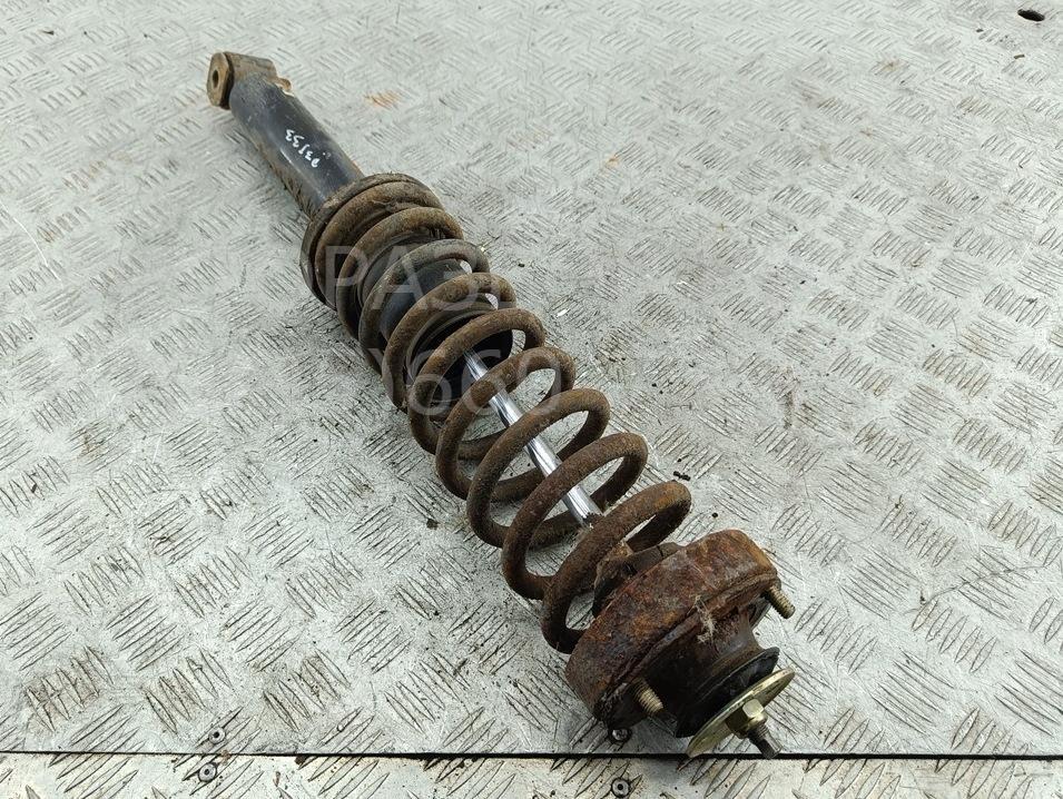 Амортизатор задний левый