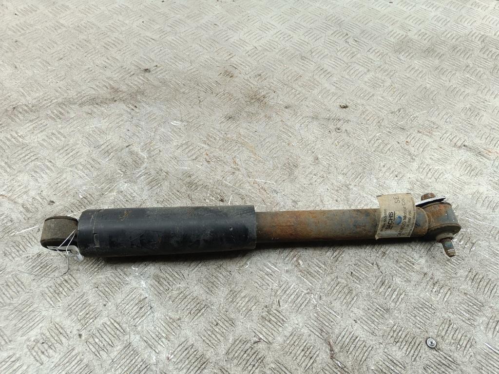 Амортизатор задний левый