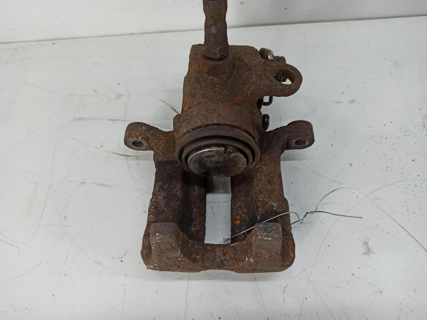 Суппорт задний левый