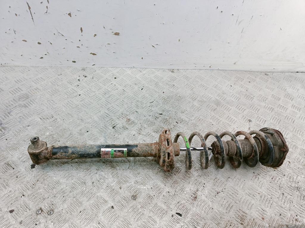 Амортизатор задний левый