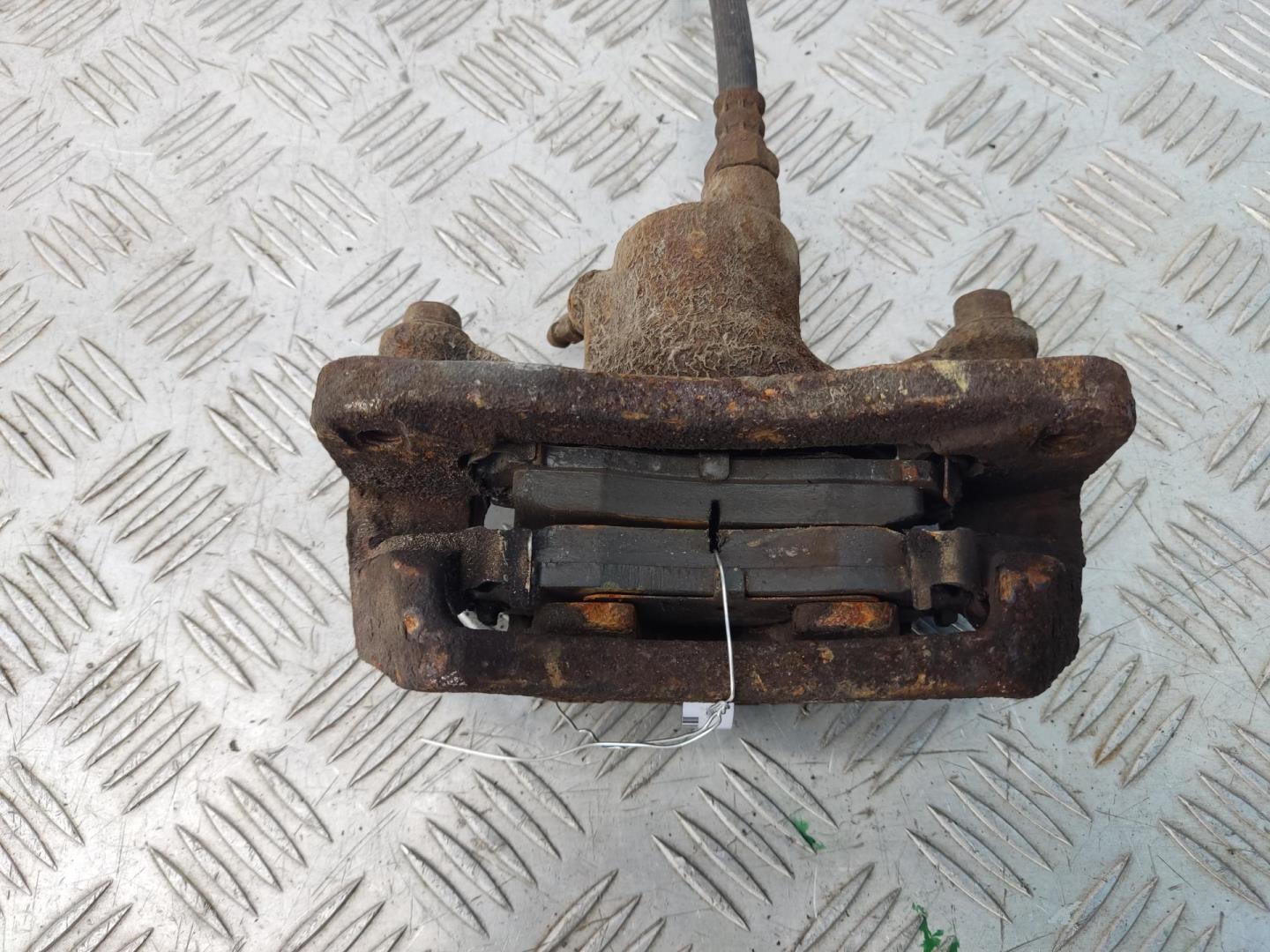 Суппорт задний левый