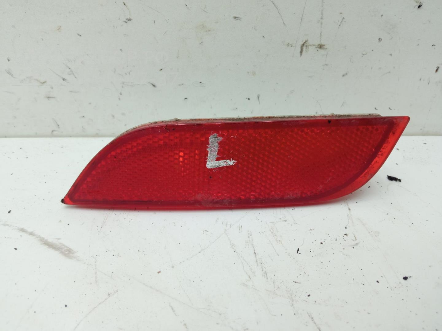 Отражатель в бампер задний левый