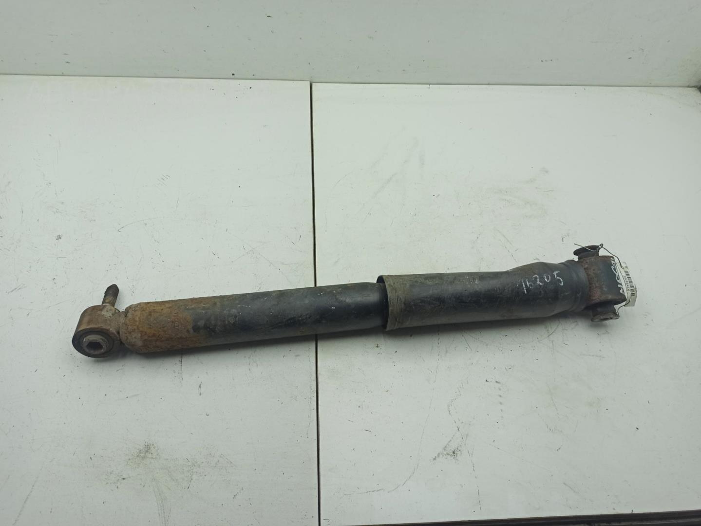 Амортизатор задний левый