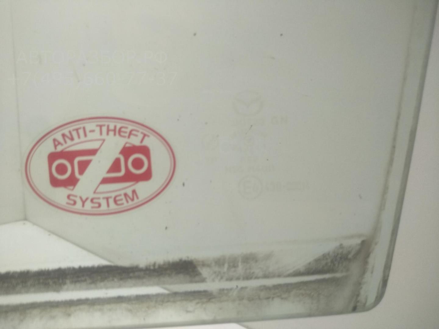 Стекло двери передней левой