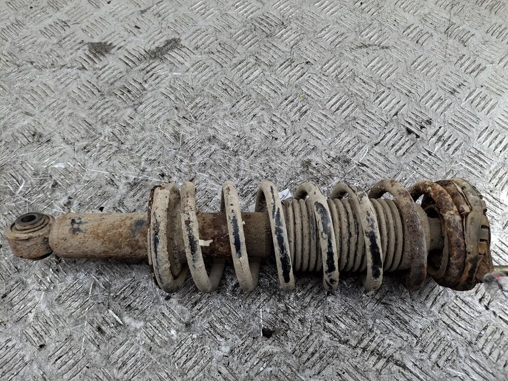 Амортизатор задний левый