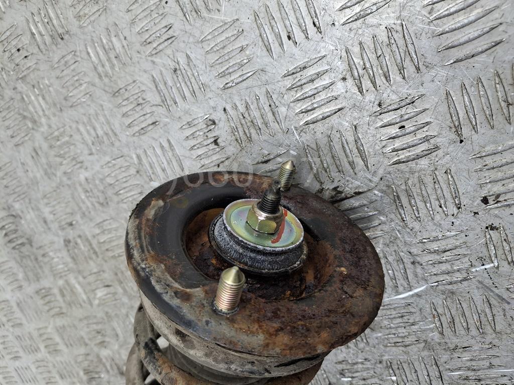 Амортизатор задний левый