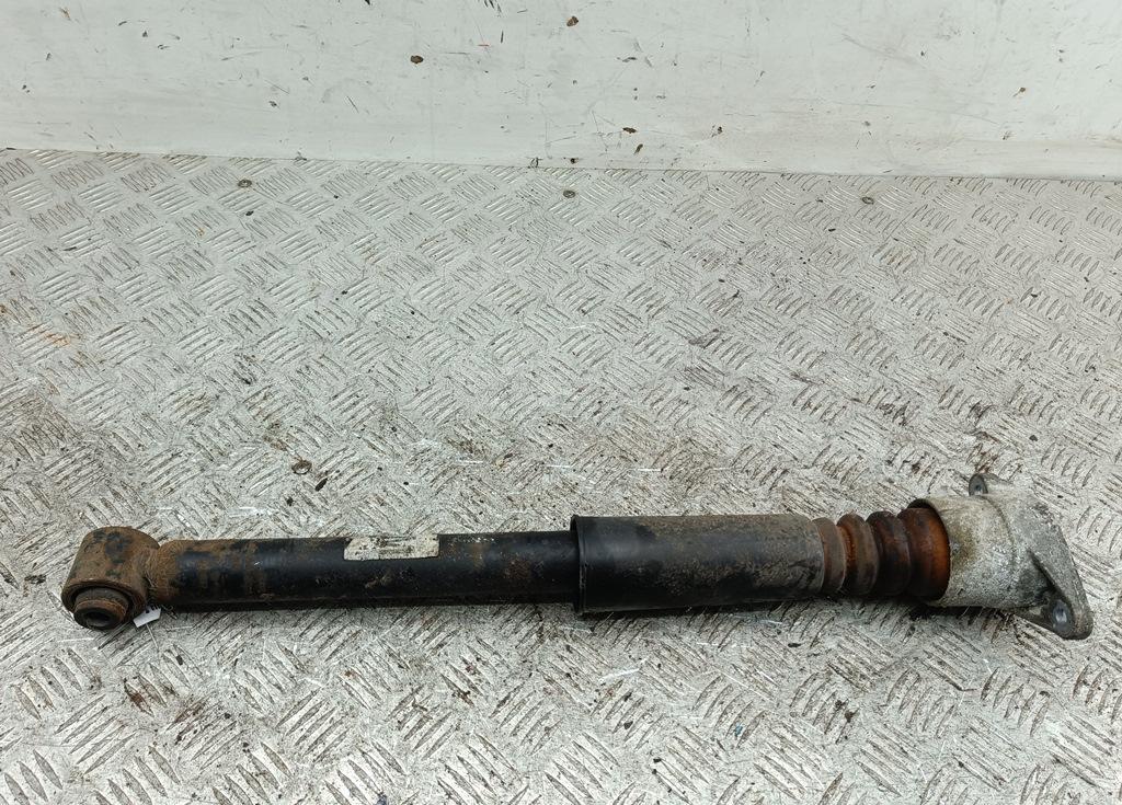 Амортизатор задний левый