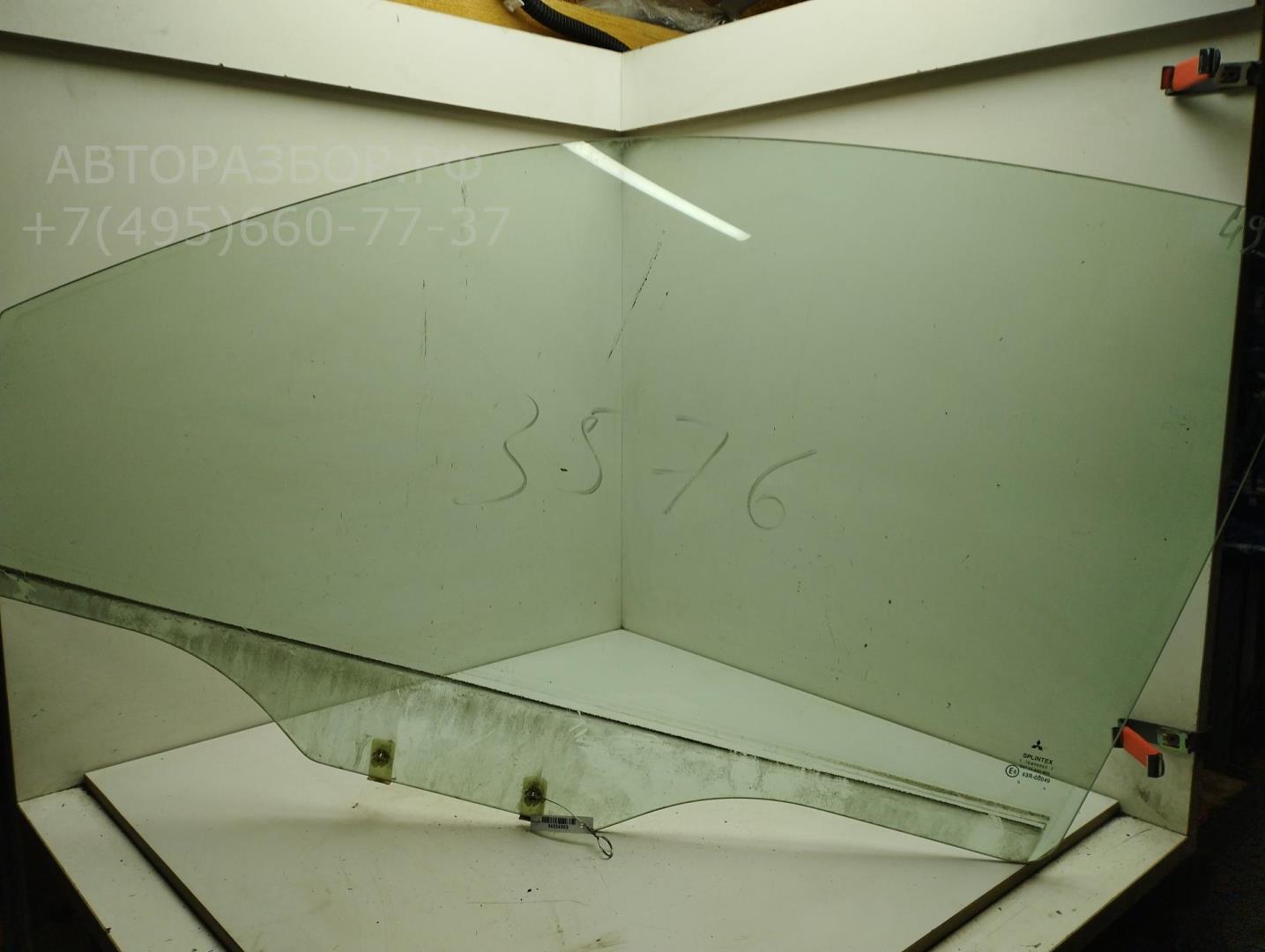 Стекло двери передней левой