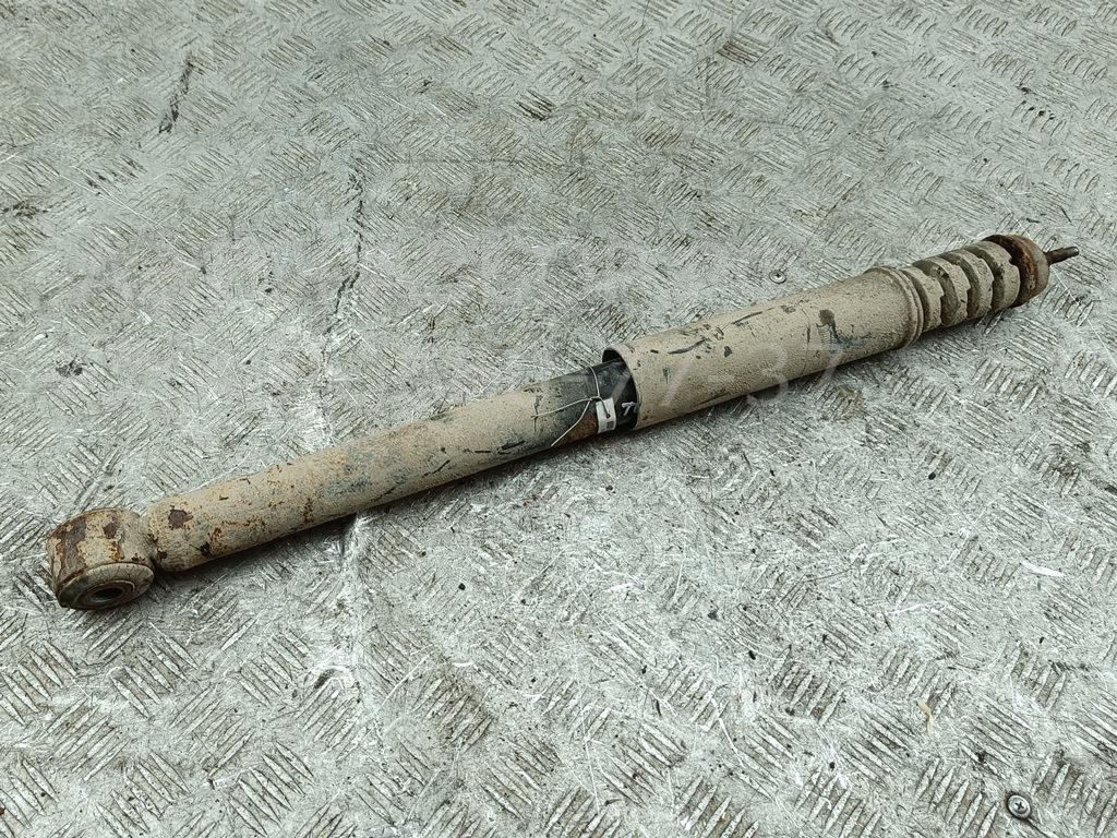 Амортизатор задний левый