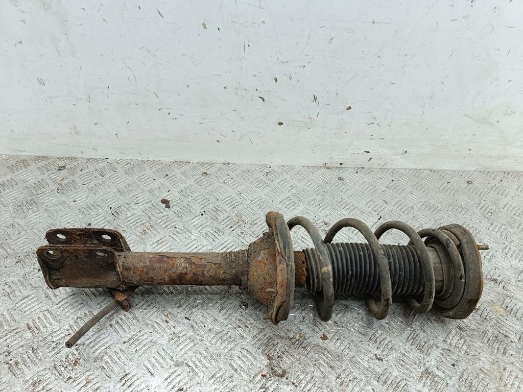 Амортизатор задний левый