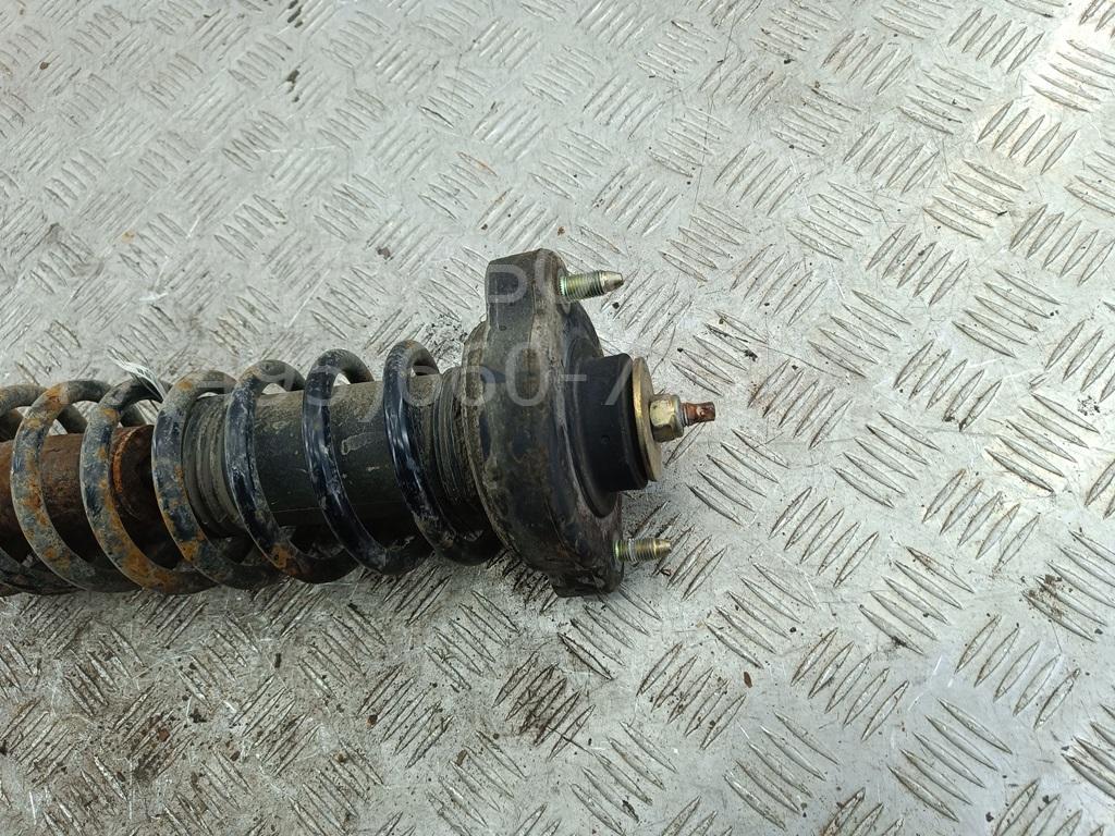 Амортизатор задний левый