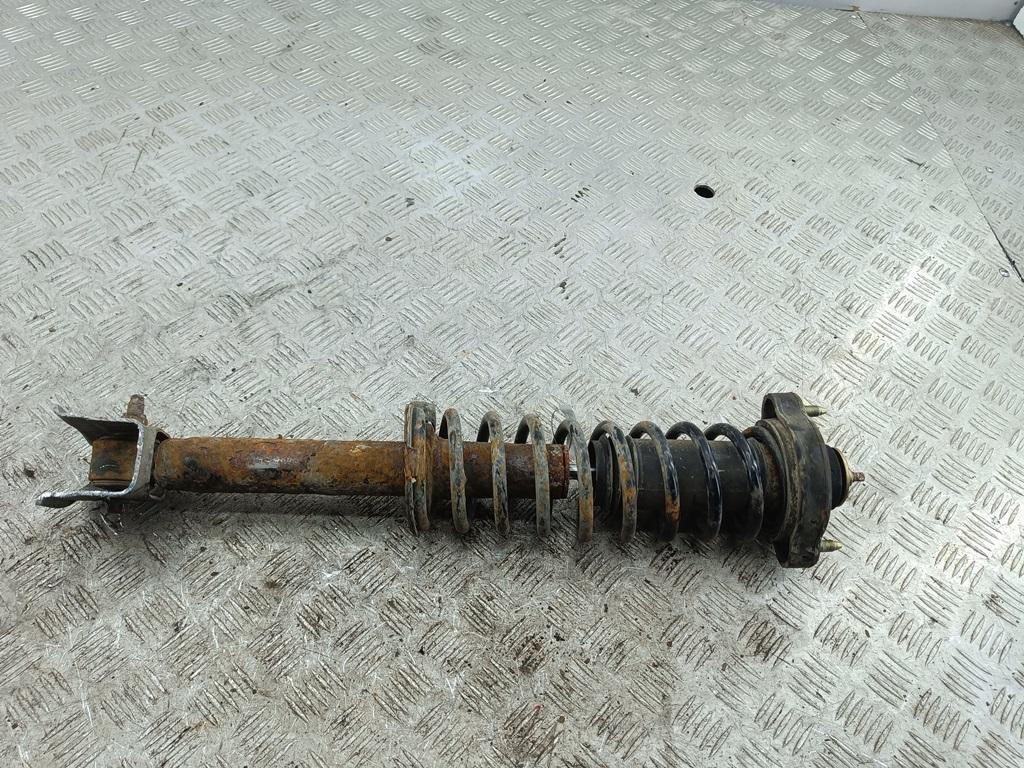 Амортизатор задний левый