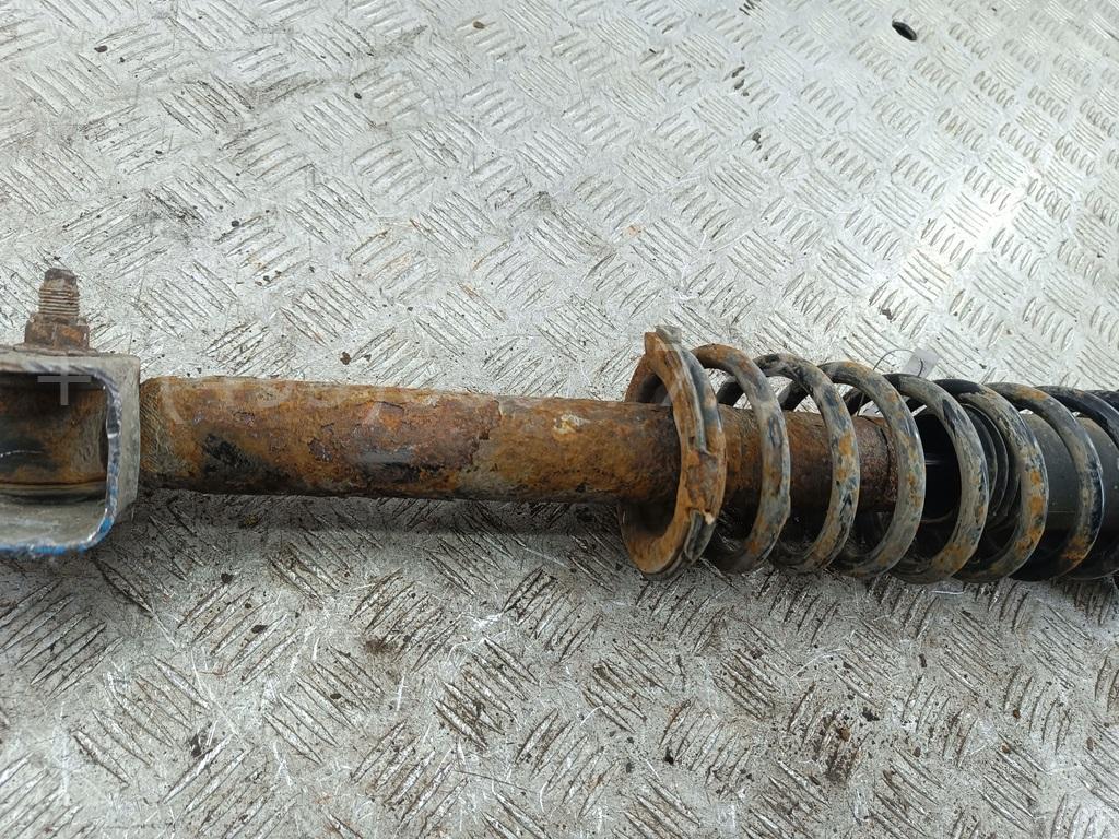 Амортизатор задний левый