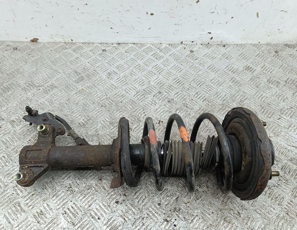 Амортизатор передний левый