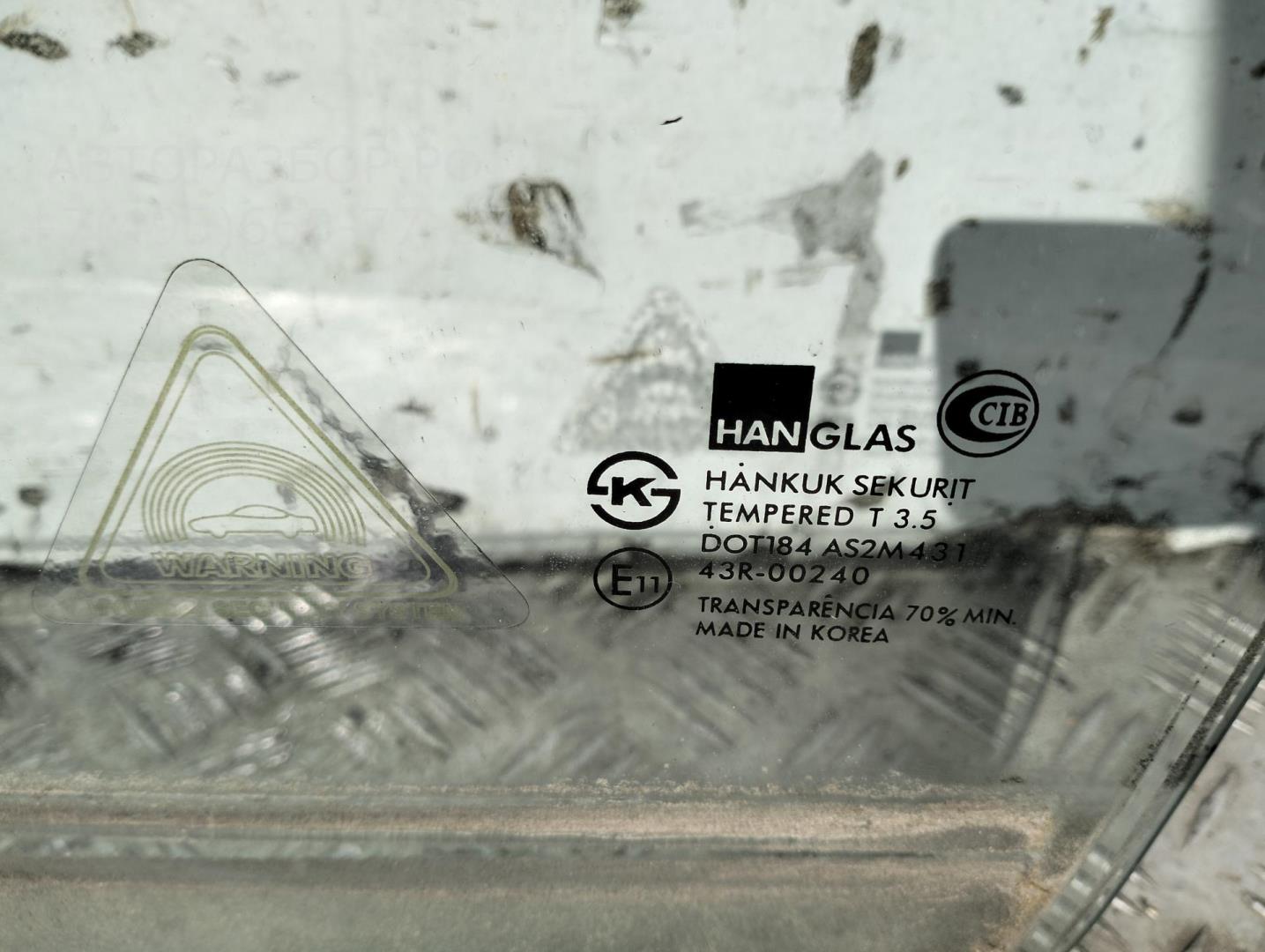 Стекло двери передней левой