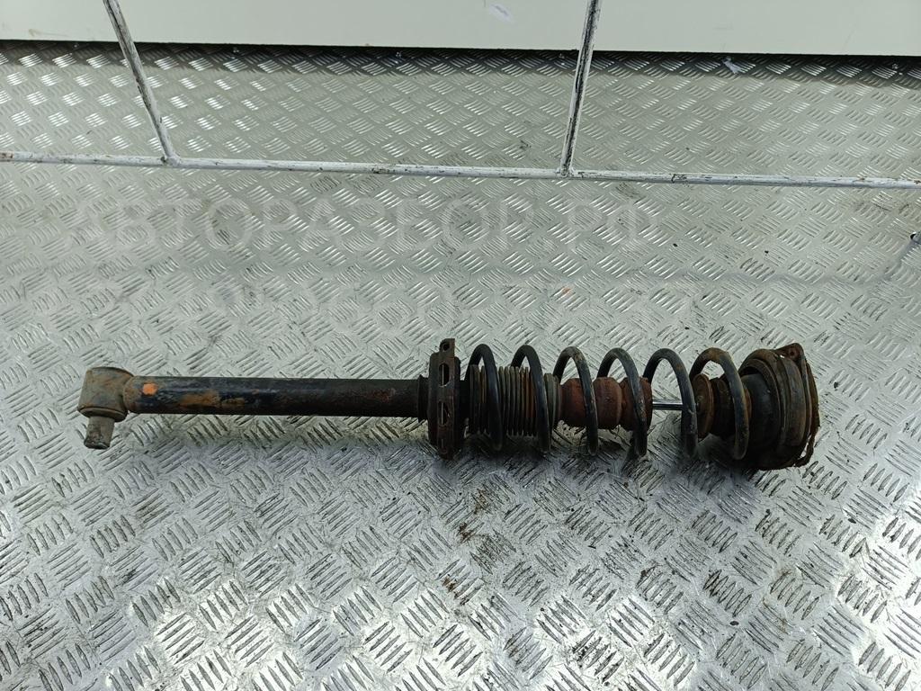 Амортизатор задний левый