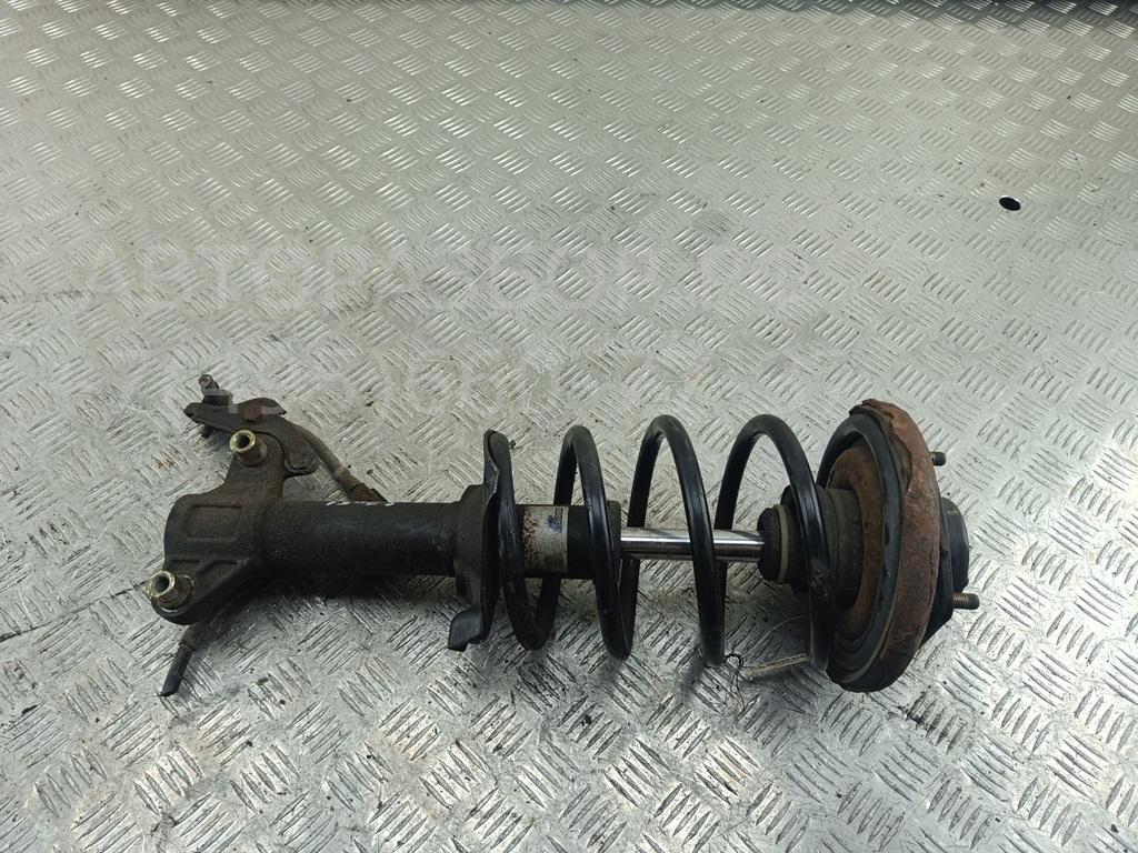 Амортизатор передний левый