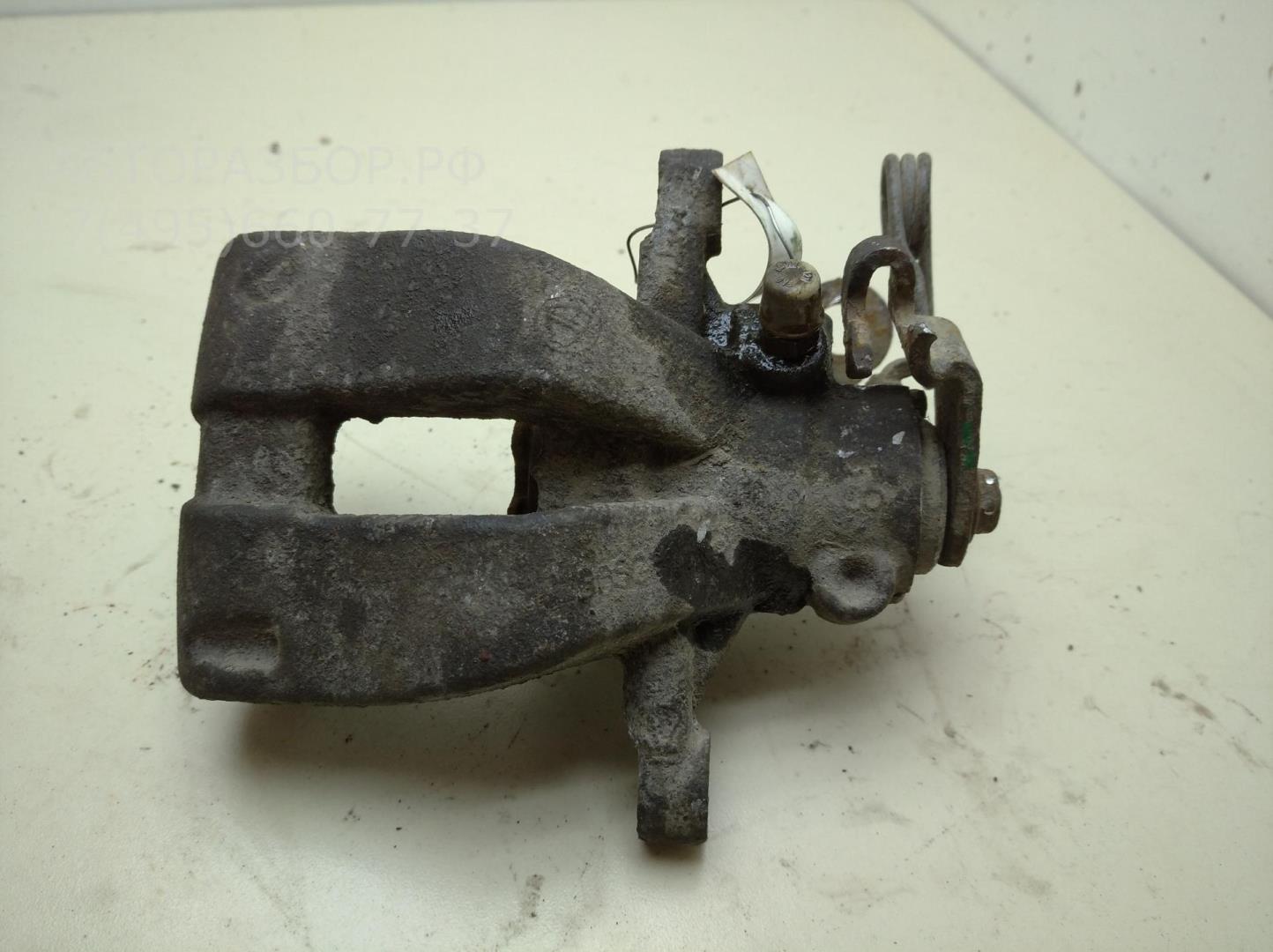 Суппорт задний левый