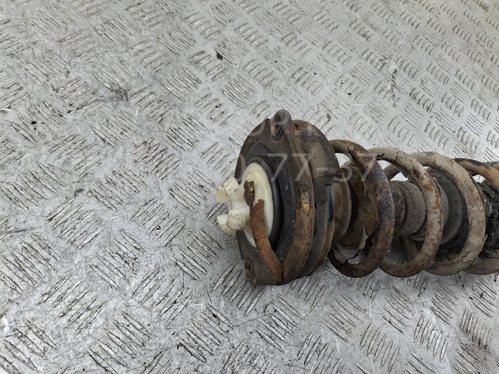 Амортизатор задний левый