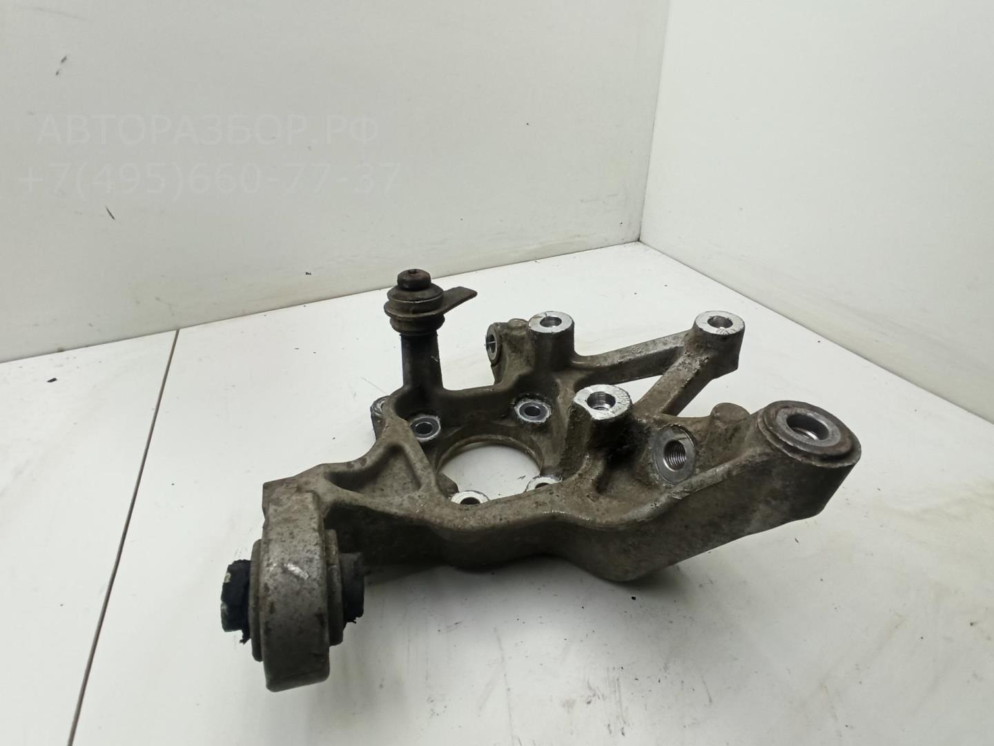 Кулак поворотный задний левый