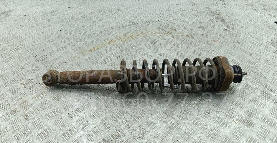 Амортизатор задний левый