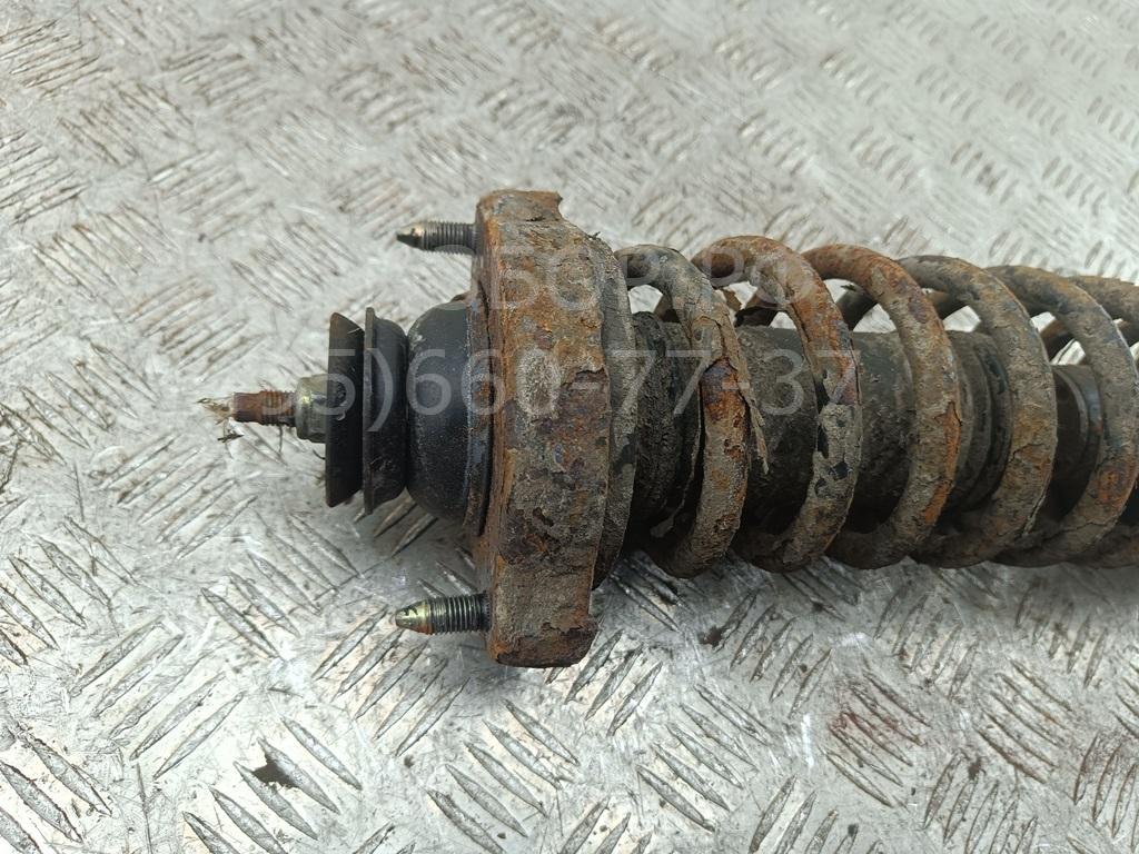 Амортизатор задний левый