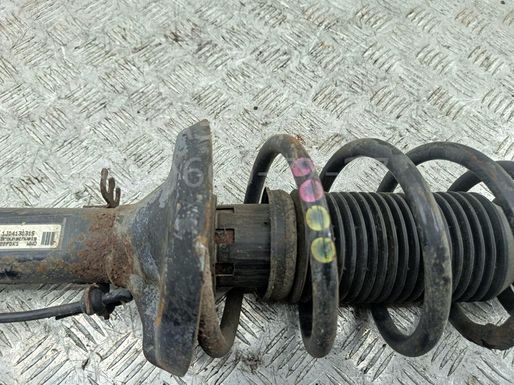 Амортизатор передний левый