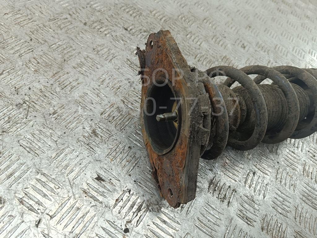 Амортизатор задний левый