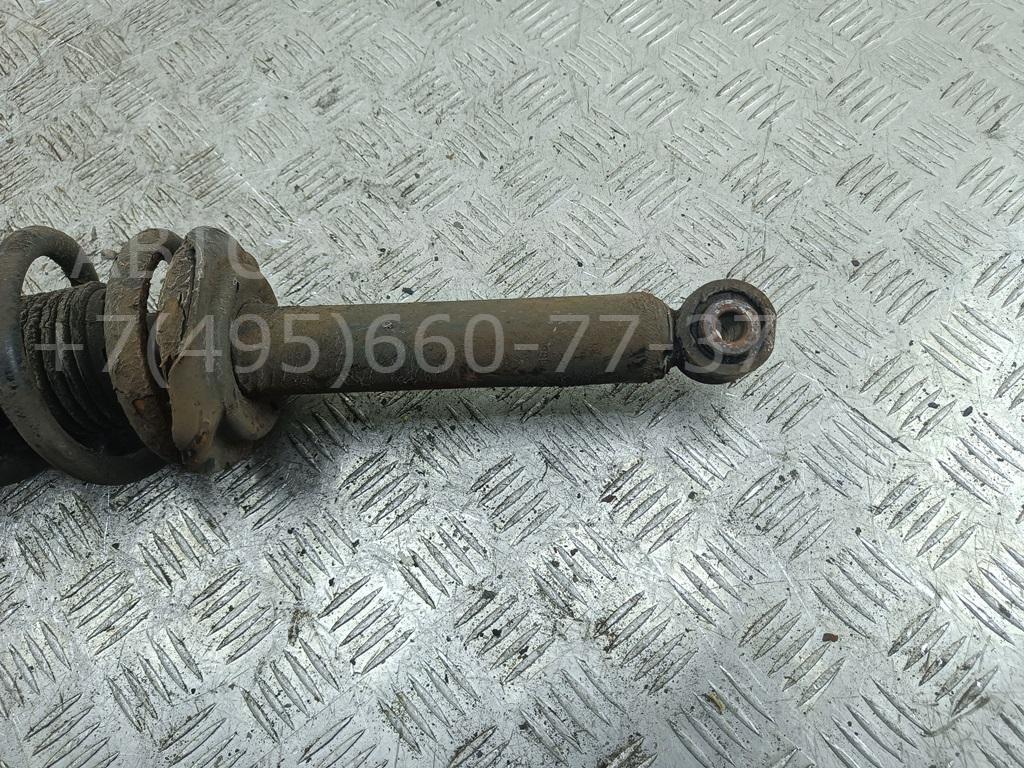 Амортизатор задний левый