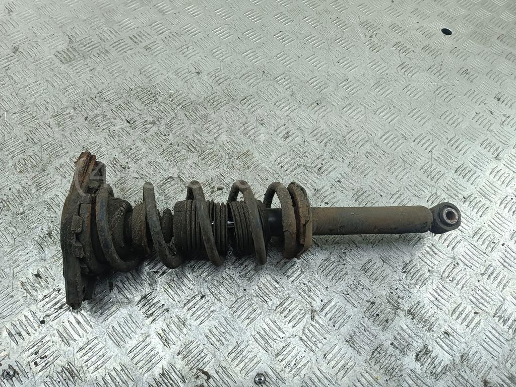 Амортизатор задний левый