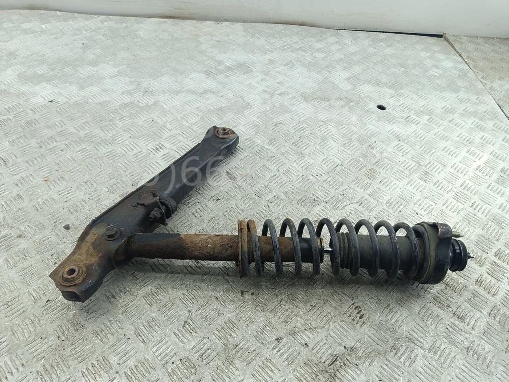 Амортизатор задний левый