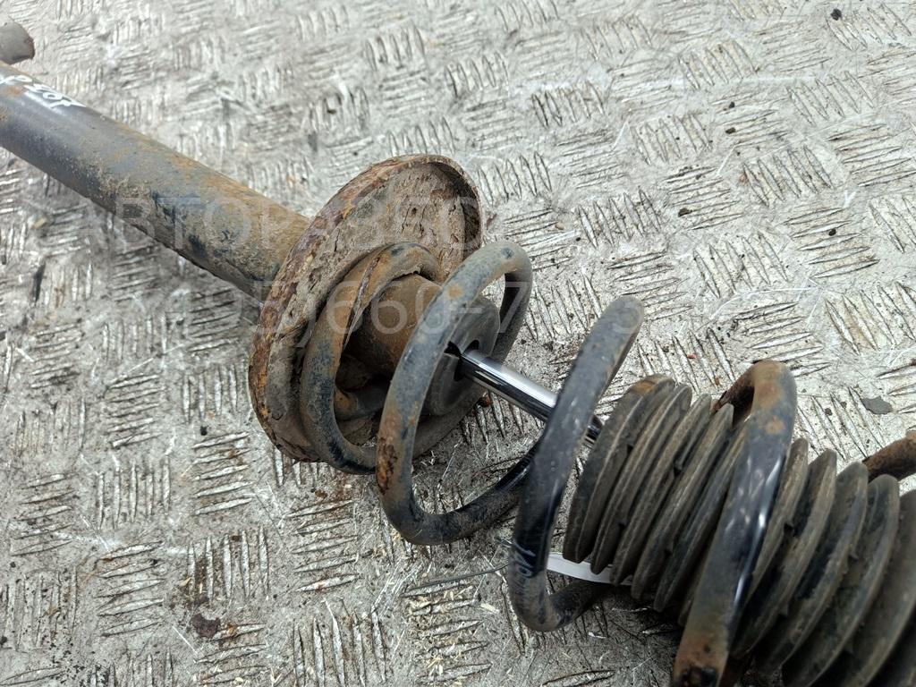 Амортизатор задний левый