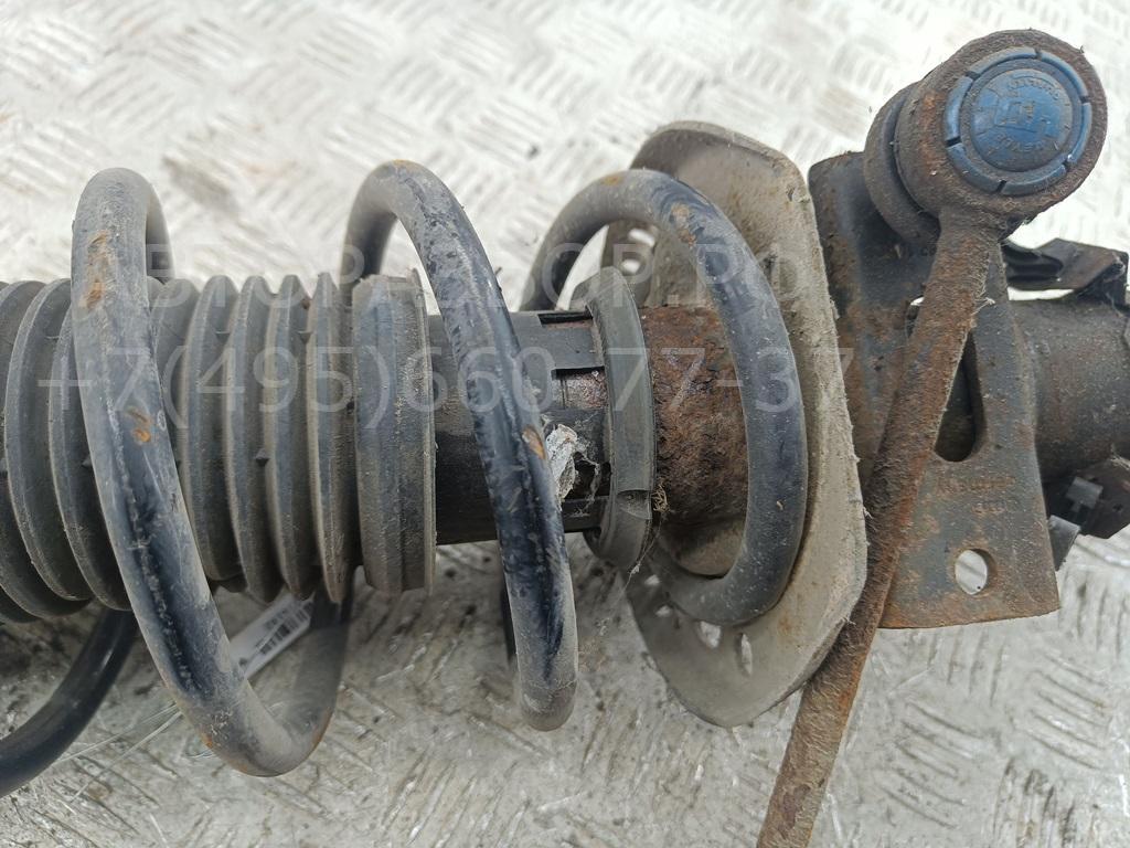 Амортизатор передний левый