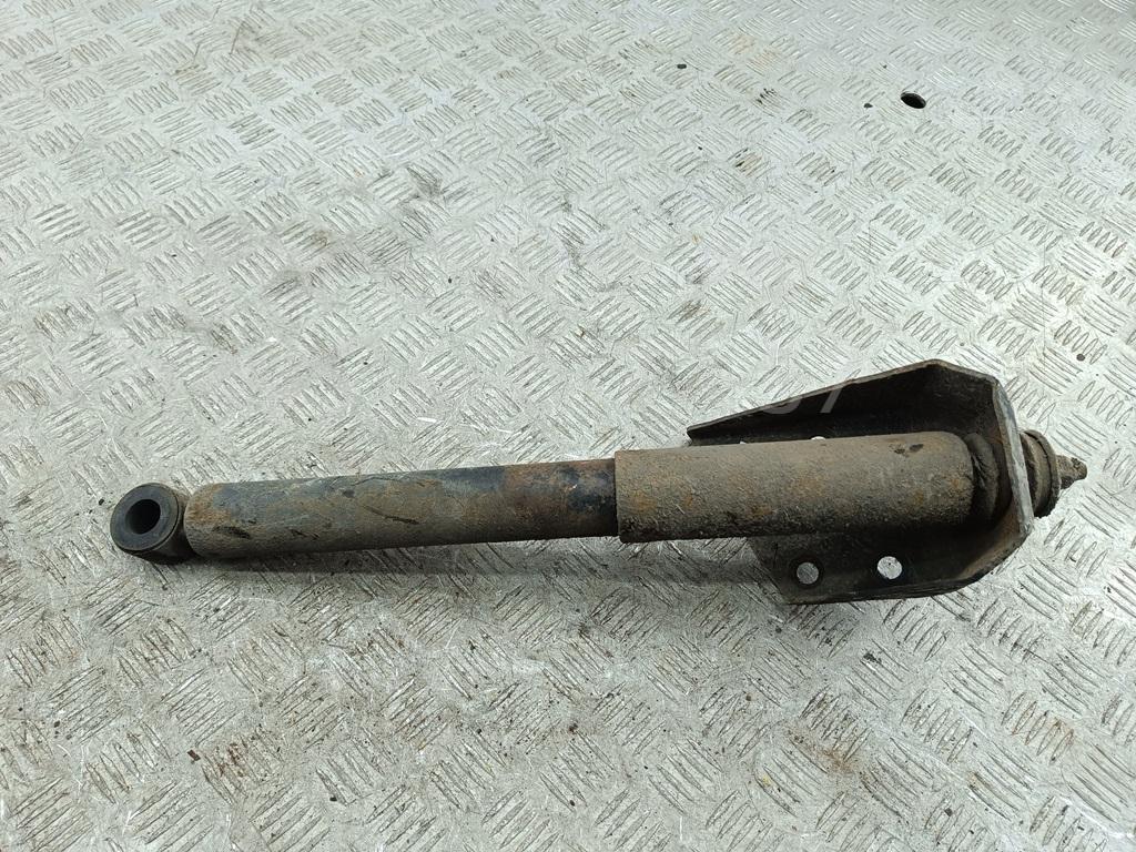 Амортизатор задний левый