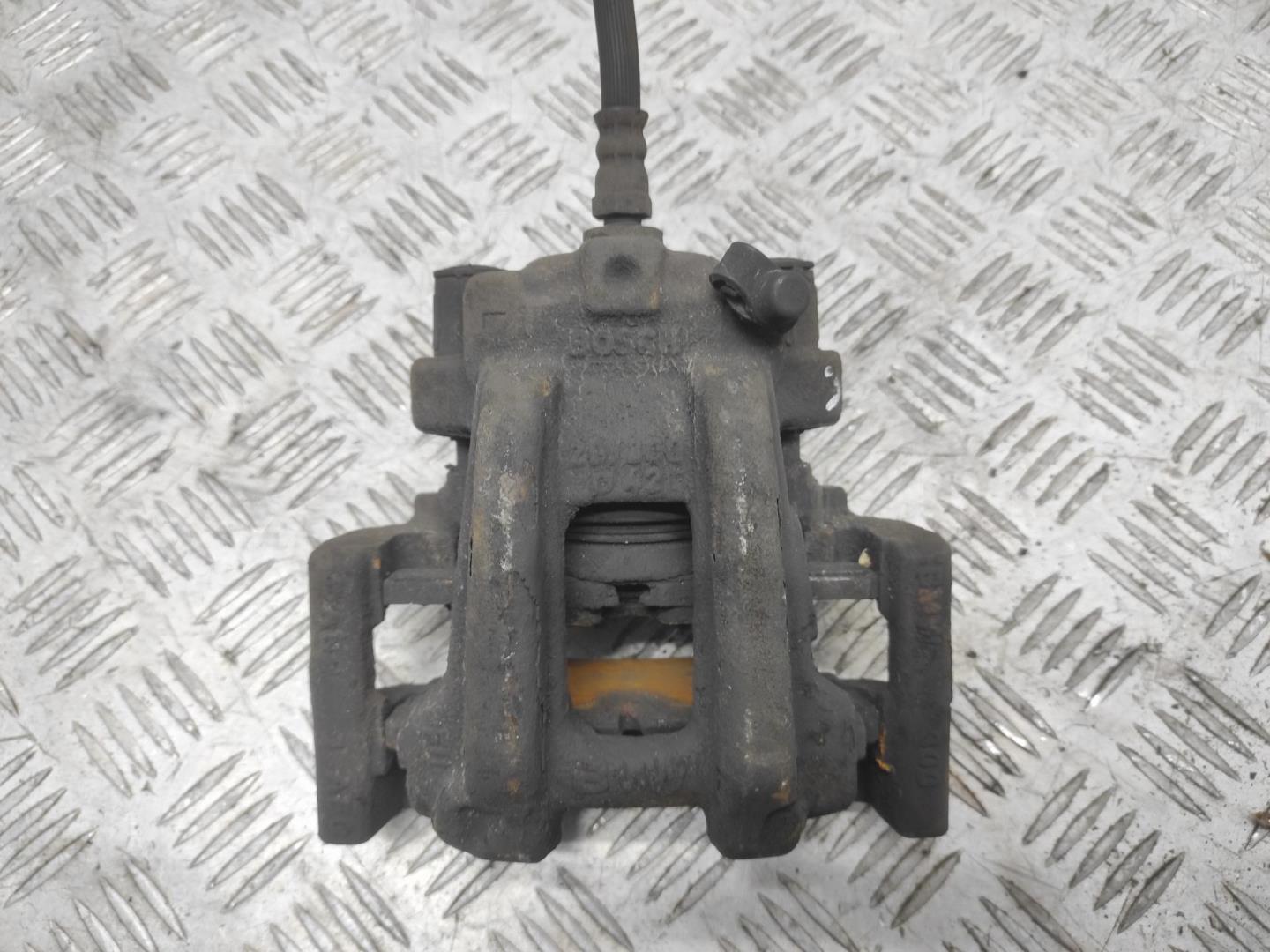 Суппорт задний левый