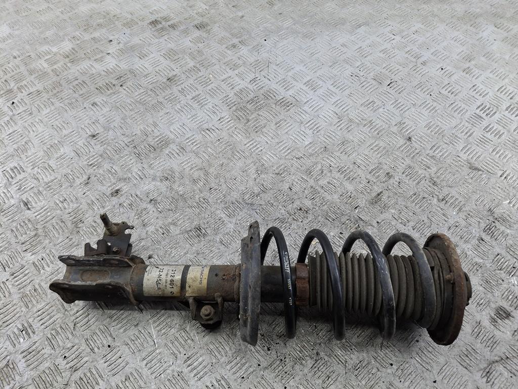 Амортизатор передний левый