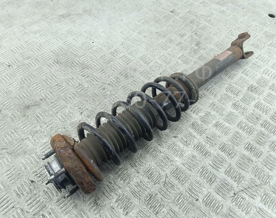 Амортизатор задний левый