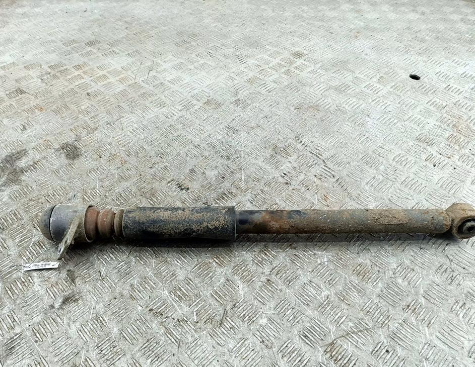 Амортизатор задний левый