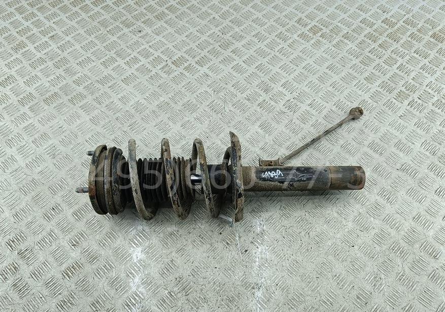 Амортизатор передний левый