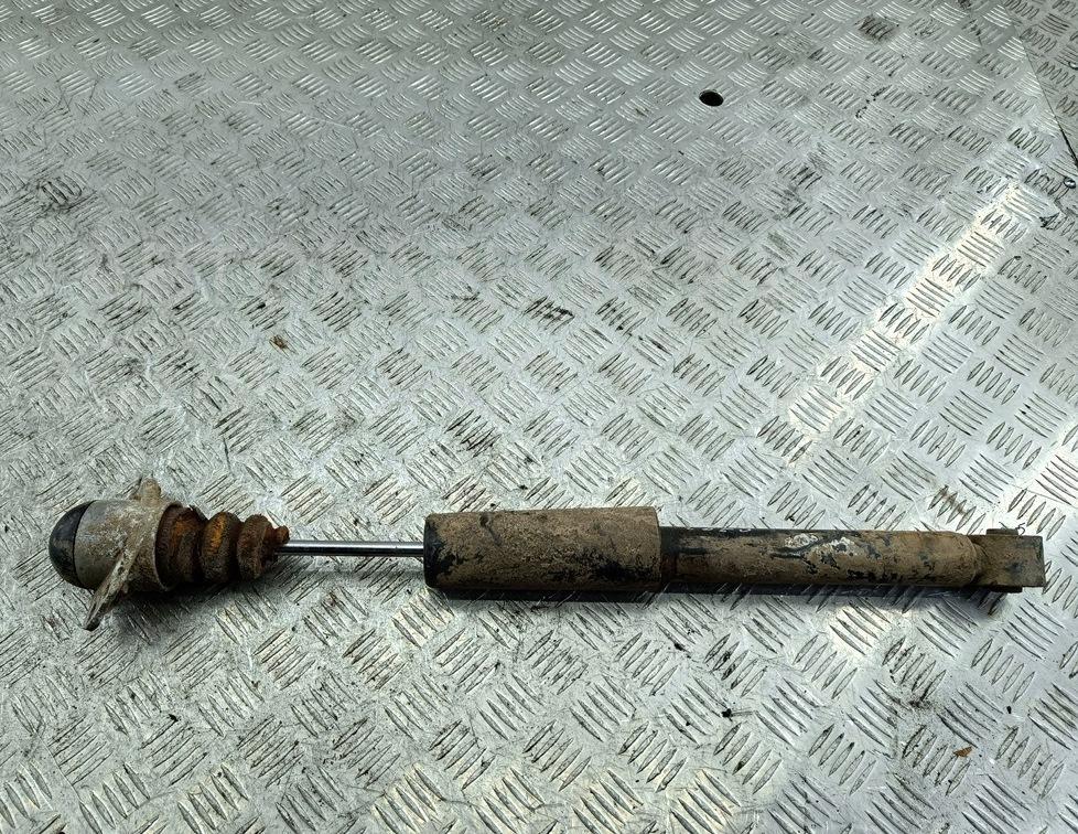 Амортизатор задний левый