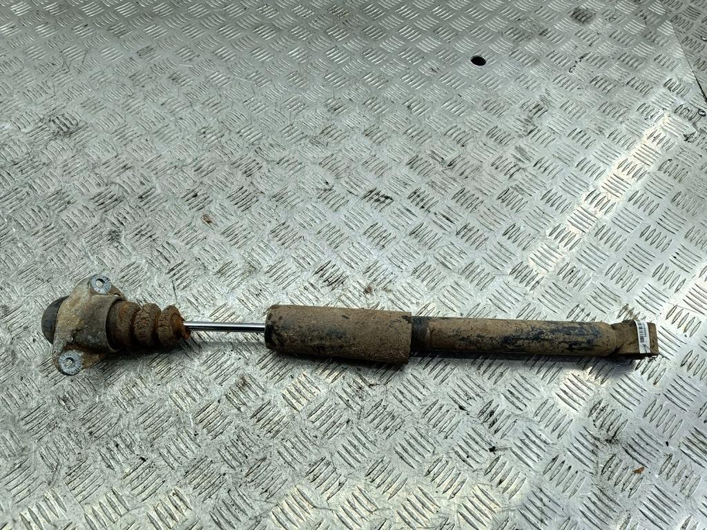 Амортизатор задний левый