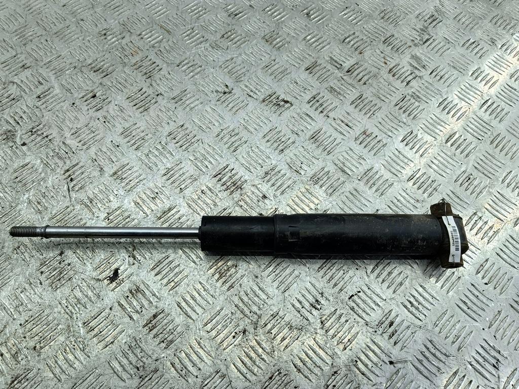 Амортизатор задний левый