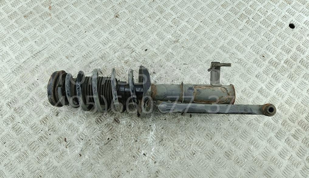 Амортизатор передний левый