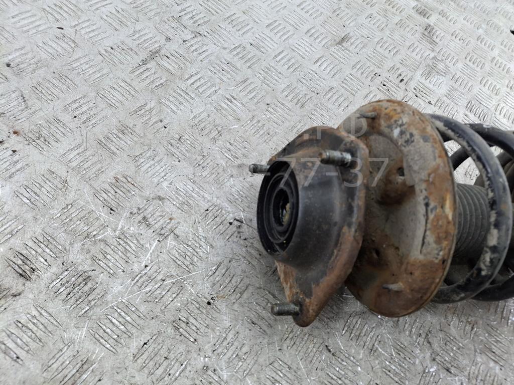 Амортизатор передний левый